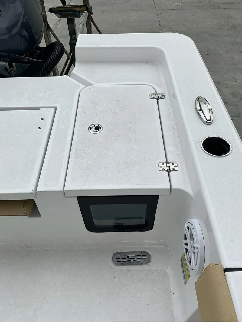 Slide: The Image of 2025 Sportsman 227 MASTERS boat deck with storage compartment and speaker. - 7