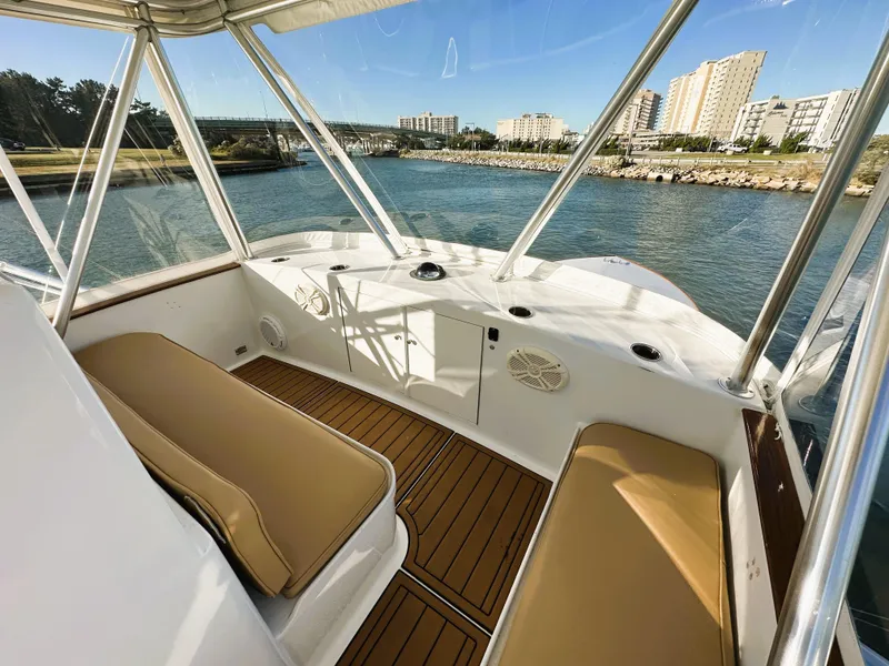 Slide: The Image of Interior view of 2000 Blackwell 47 Custom Carolina Sportfish boat with cityscape background. - 12