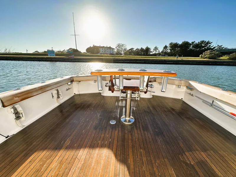 Slide: The Image of 2000 Blackwell 47 Custom Carolina Sportfish boat deck with scenic water view. - 14