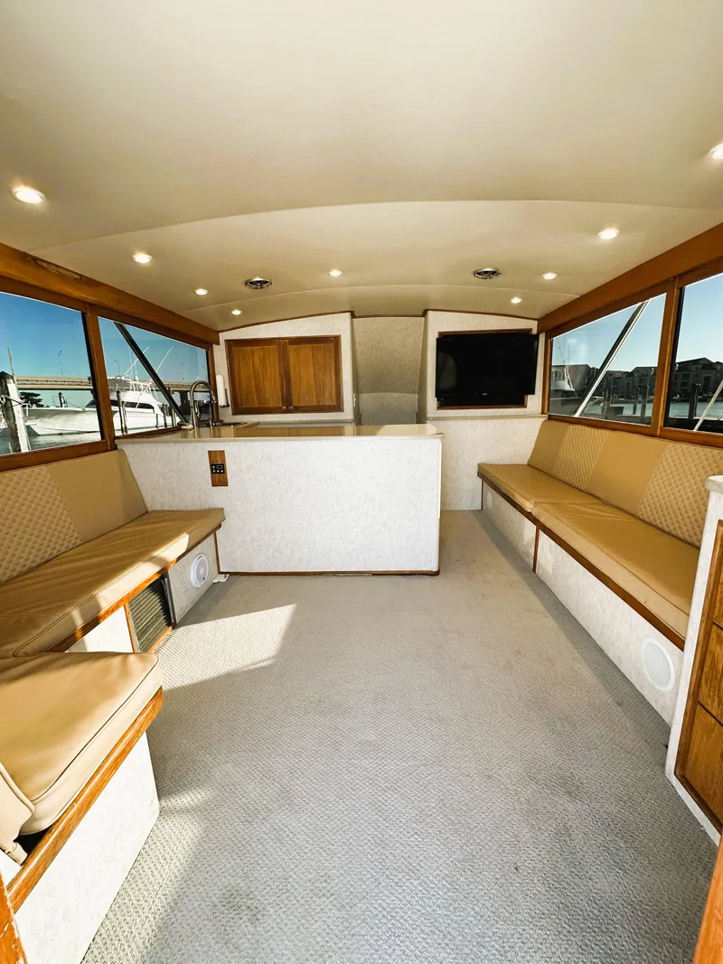 Slide: The Image of Interior of 2000 Blackwell 47 Custom Carolina Sportfish, featuring spacious seating and modern design. - 15