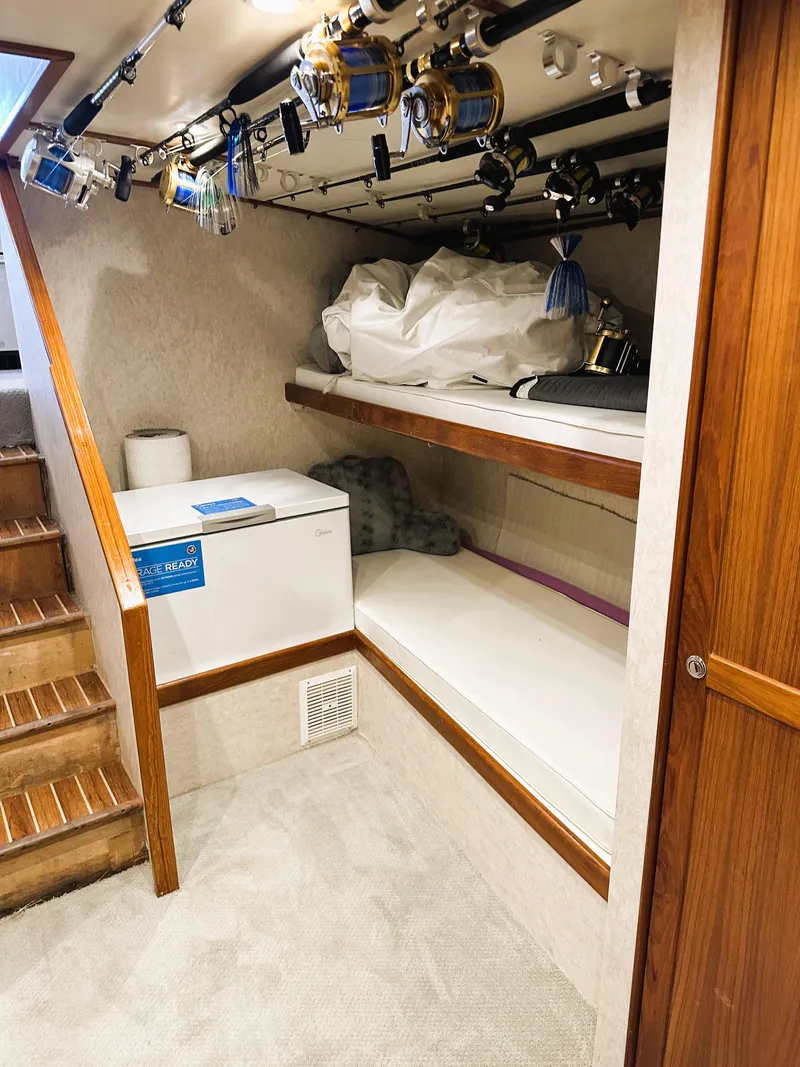 Slide: The Image of 2000 Blackwell 47 Custom Carolina Sportfish cabin with fishing gear storage. - 20