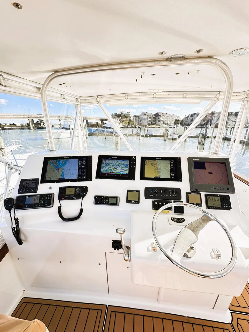 Slide: The Image of Helm of 2000 Blackwell 47 Custom Carolina Sportfish with advanced navigation equipment. - 9