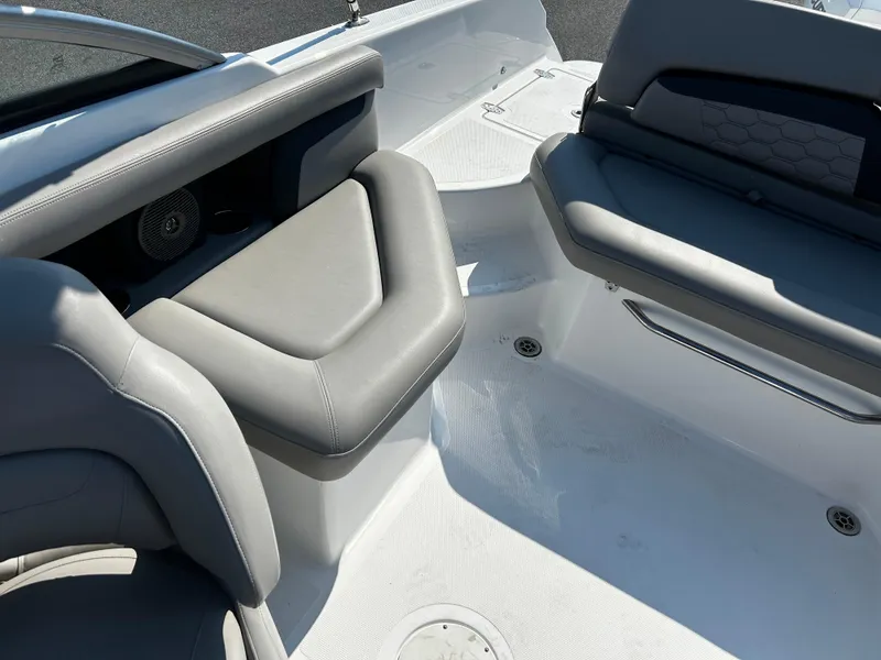 Slide: The Image of 2023 Four Winns HD3 OB boat interior with gray seating and modern design. - 11