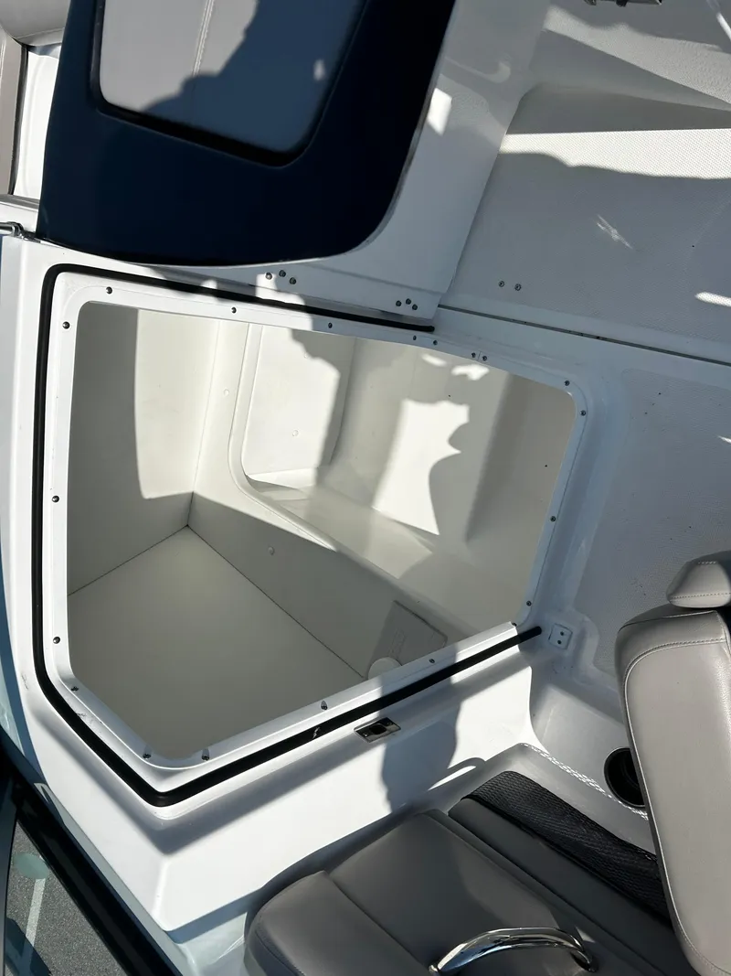 Slide: The Image of 2023 Four Winns HD3 OB boat storage compartment with open hatch. - 13