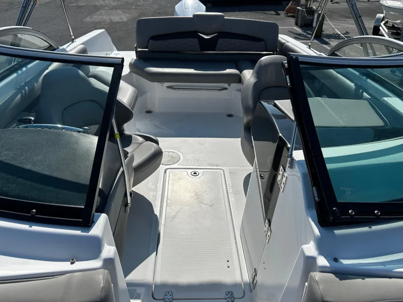 Slide: The Image of 2023 Four Winns HD3 OB boat interior with seating and windshield. - 16