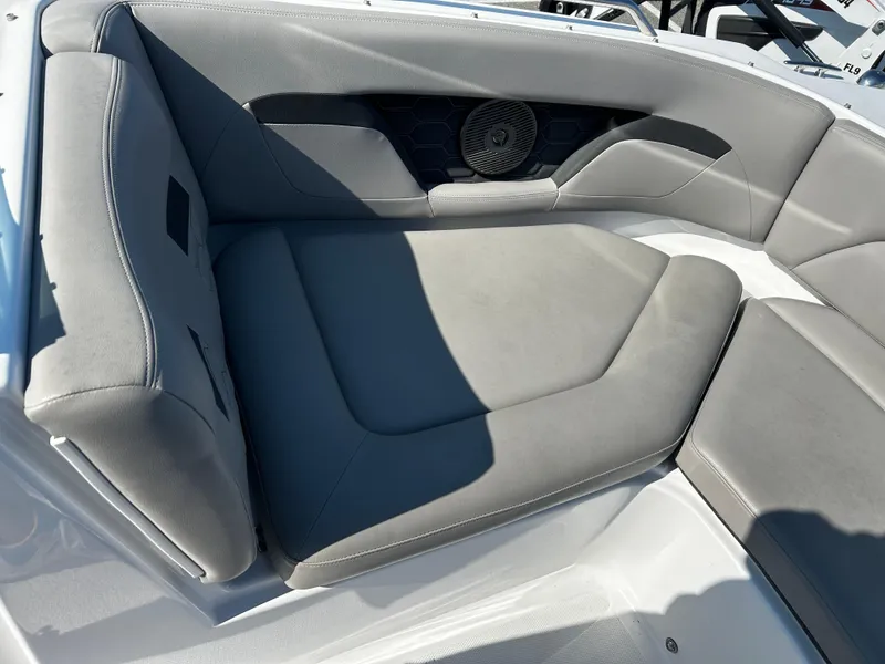 Slide: The Image of 2023 Four Winns HD3 OB boat interior with gray cushioned seating and speaker. - 6