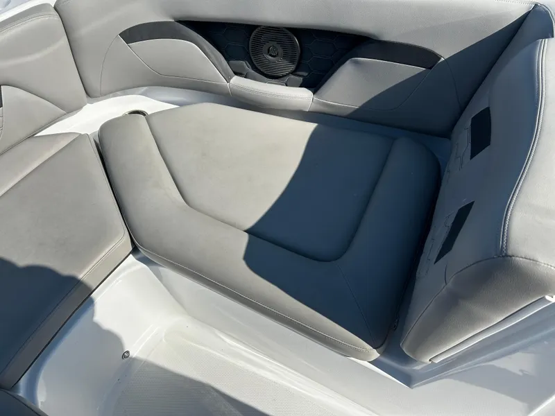 Slide: The Image of 2023 Four Winns HD3 OB boat interior with gray cushioned seating. - 7