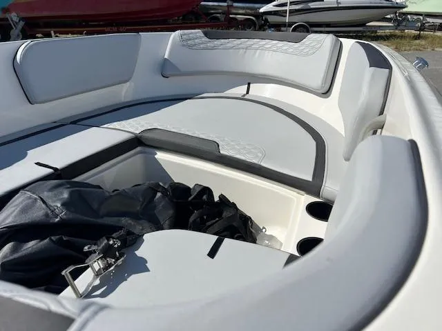 Slide: The Image of 2023 Bayliner Element M15 boat interior with cushioned seating and storage compartments. - 4