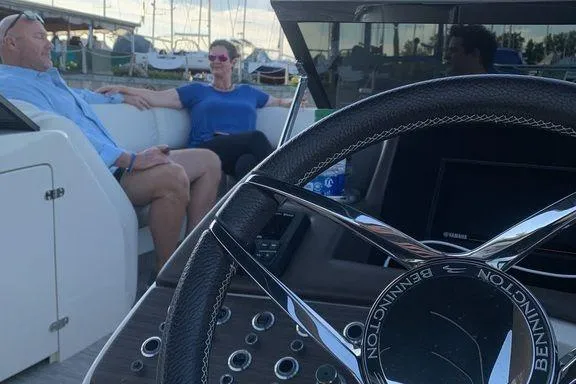 Slide: The Image of Control panel of 2021 Bennington 27 QXSBWA X2 boat, featuring throttle and switches. - 13