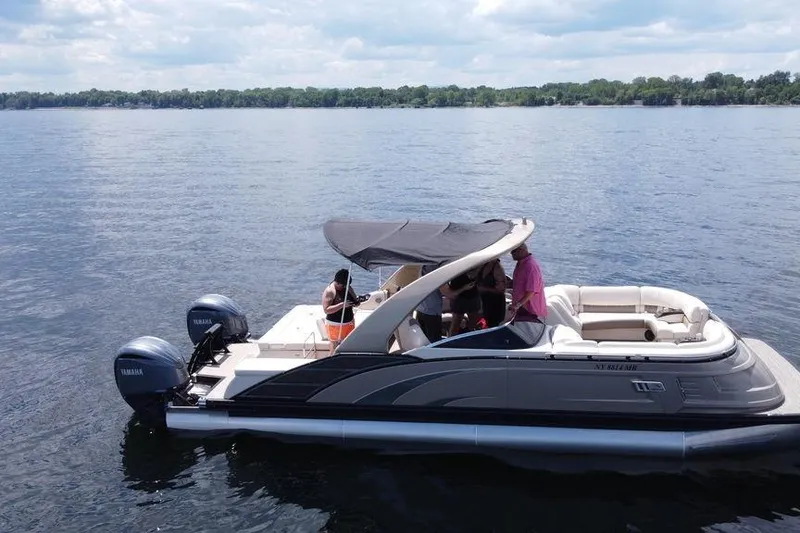 Slide: The Image of 2021 Bennington 27 QXSBWA X2 pontoon boat with canopy, parked outdoors. - 15
