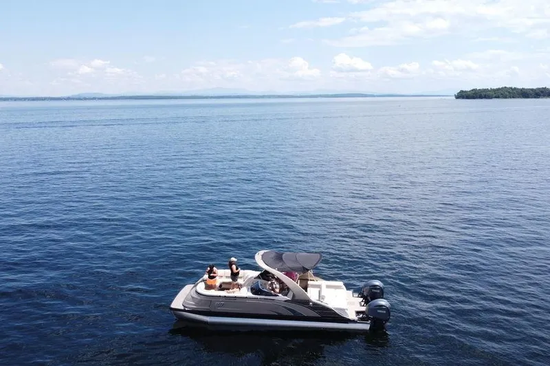 Slide: The Image of 2021 Bennington 27 QXSBWA X2 pontoon boat with spacious seating and elegant design. - 16