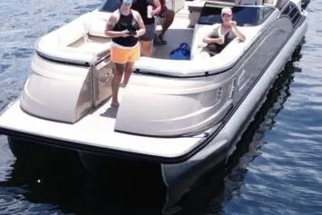 Slide: The Image of 2021 Bennington 27 QXSBWA X2 boat with canopy, interior view under clear sky. - 23