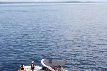 Slide: The Image of 2021 Bennington 27 QXSBWA X2 pontoon boat with luxurious seating and sleek design. - 24