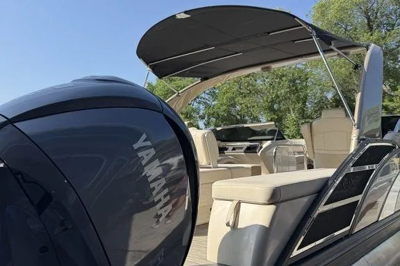 Slide: The Image of 2021 Bennington 27 QXSBWA X2 boat detail with sleek design and QX logo. - 25