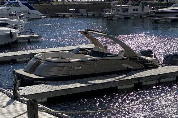 Slide: The Image of 2021 Bennington 27 QXSBWA X2 boat interior with beige seating and flooring. - 27