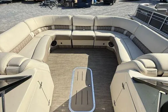 Slide: The Image of 2021 Bennington 27 QXSBWA X2 boat cruising on a calm lake. - 39