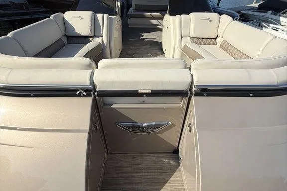 Slide: The Image of 2021 Bennington 27 QXSBWA X2 boat with dual 300 V6 engines in a marina lift. - 40