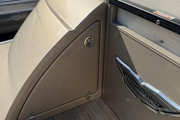 Slide: The Image of 2021 Bennington 27 QXSBWA X2 pontoon boat cruising on a calm lake. - 41