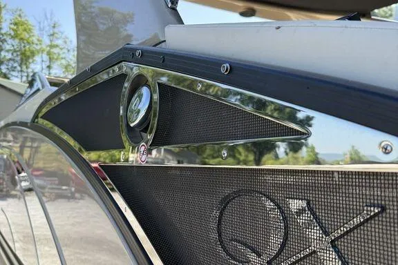 Slide: The Image of 2021 Bennington 27 QXSBWA X2 pontoon boat with luxurious seating at a marina. - 48