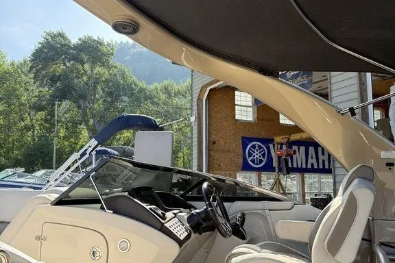 Slide: The Image of 2021 Bennington 27 QXSBWA X2 pontoon boat on calm lake waters. - 50