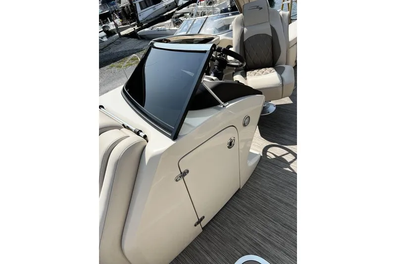Slide: The Image of 2021 Bennington 27 QXSBWA X2 boat interior with sleek console and luxurious seating. - 60