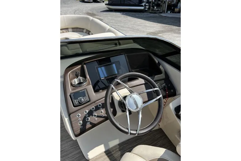 Slide: The Image of 2021 Bennington 27 QXSBWA X2 boat dashboard with steering wheel and control panel. - 65