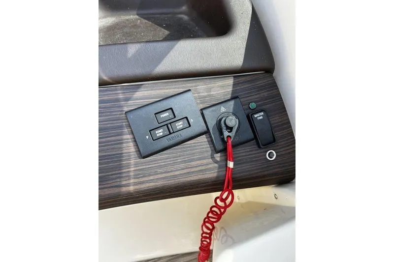 Slide: The Image of Control panel of 2021 Bennington 27 QXSBWA X2 boat with Yamaha start-stop buttons. - 66
