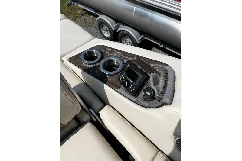Slide: The Image of 2021 Bennington 27 QXSBWA X2 boat console with cup holders and USB port. - 69