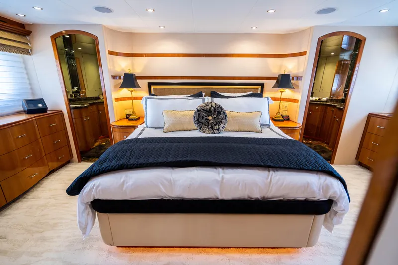 Slide: The Image of Luxurious bedroom interior of 2008 Hatteras 80 Motor Yacht with elegant bedding and warm lighting. - 11