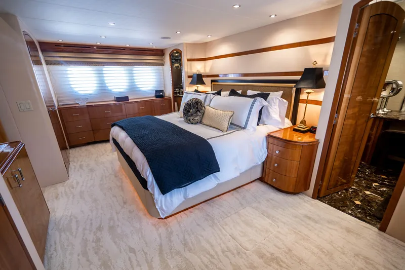 Slide: The Image of Luxurious bedroom interior of 2008 Hatteras 80 Motor Yacht with elegant furnishings. - 12