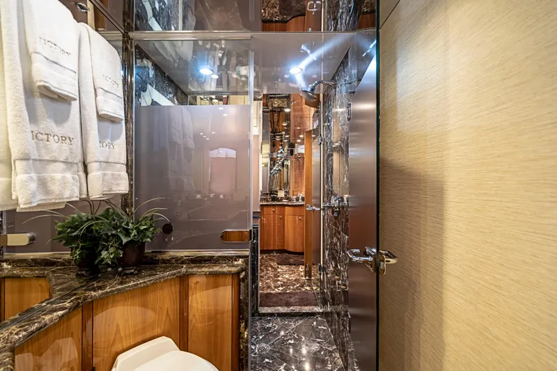 Slide: The Image of Luxurious bathroom interior of 2008 Hatteras 80 Motor Yacht with marble and wood finishes. - 13
