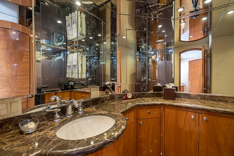 Slide: The Image of Luxurious bathroom in 2008 Hatteras 80 Motor Yacht with marble countertops and mirrored walls. - 14