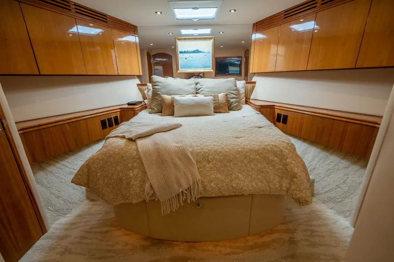 Slide: The Image of Luxurious bedroom interior of 2008 Hatteras 80 Motor Yacht with elegant wood finishes. - 15