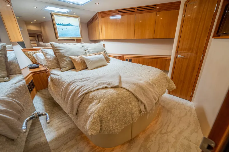 Slide: The Image of Luxurious bedroom interior of 2008 Hatteras 80 Motor Yacht with elegant wood finishes. - 16