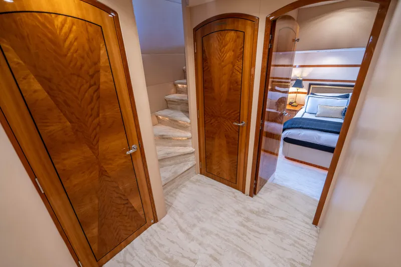 Slide: The Image of Luxurious interior of 2008 Hatteras 80 Motor Yacht with elegant wood doors and cozy bedroom. - 17