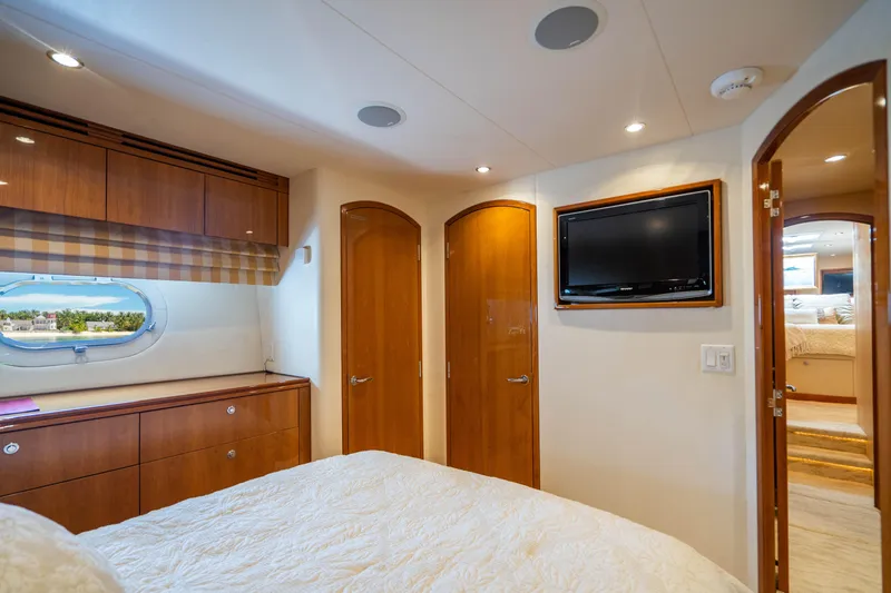 Slide: The Image of Luxurious bedroom interior of 2008 Hatteras 80 Motor Yacht with wood accents and TV. - 19