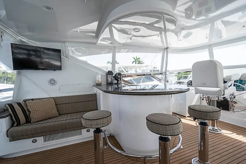 Slide: The Image of Luxurious interior of 2008 Hatteras 80 Motor Yacht with bar and seating area. - 24