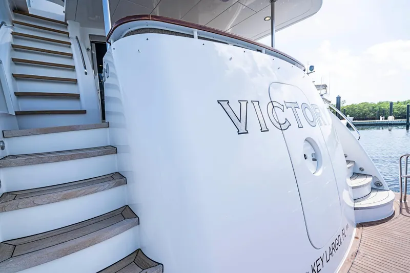 Slide: The Image of 2008 Hatteras 80 Motor Yacht with stairs, docked at a marina. - 27