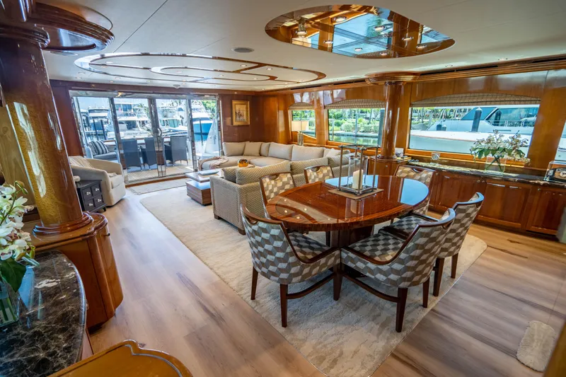 Slide: The Image of Luxurious interior of 2008 Hatteras 80 Motor Yacht with elegant dining and seating area. - 6