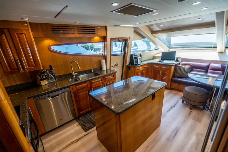 Slide: The Image of Luxurious kitchen interior of 2008 Hatteras 80 Motor Yacht with modern amenities and elegant design. - 7