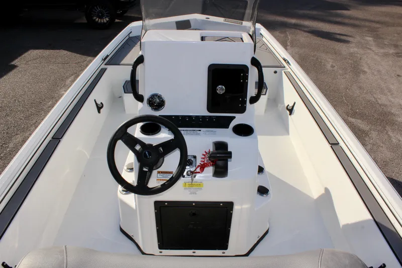 Slide: The Image of Avid 20 Rogue CC 2026 boat console with steering wheel and controls. - 15