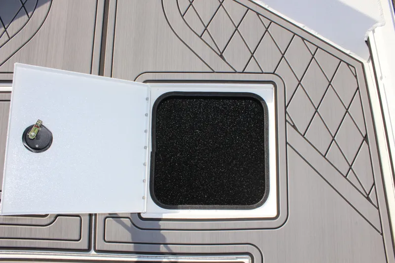 Slide: The Image of Livewell compartment in 2026 Avid 20 Rogue CC boat, featuring a cushioned seat. - 25