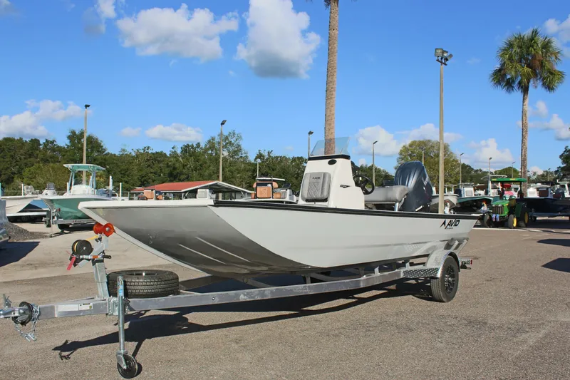 Slide: The Image of 2026 Avid 20 Rogue CC boat on trailer in outdoor showroom. - 3