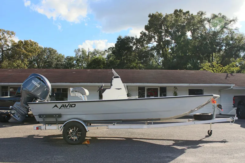 Slide: The Image of 2026 Avid 20 Rogue CC boat on trailer outside dealership. - 5