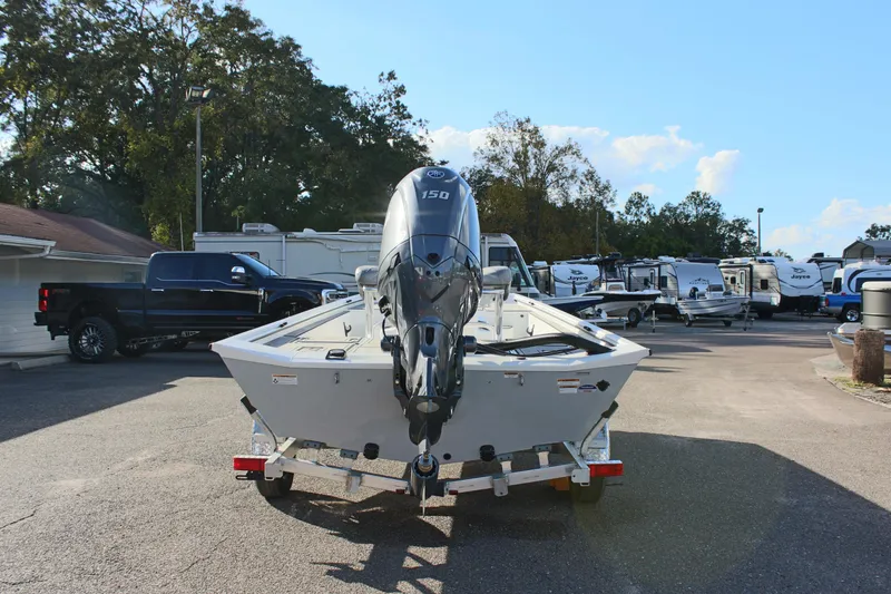 Slide: The Image of 2026 Avid 20 Rogue CC boat with Yamaha engine on trailer, parked outdoors. - 7
