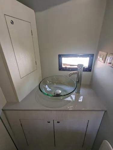 Slide: The Image of Modern bathroom sink on 2021 Panamera Yacht PY 100 with glass basin and sleek faucet. - 10