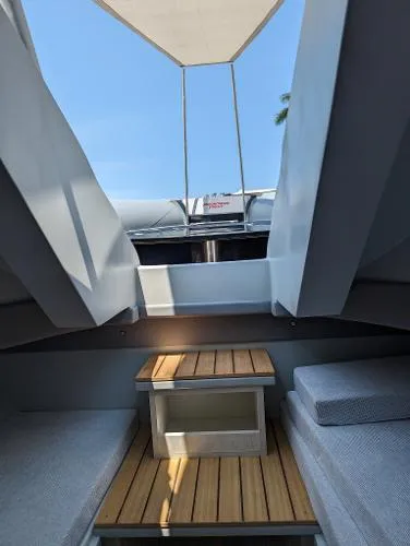 Slide: The Image of Interior view of 2021 Panamera Yacht PY 100, featuring sleek design and wooden accents. - 8