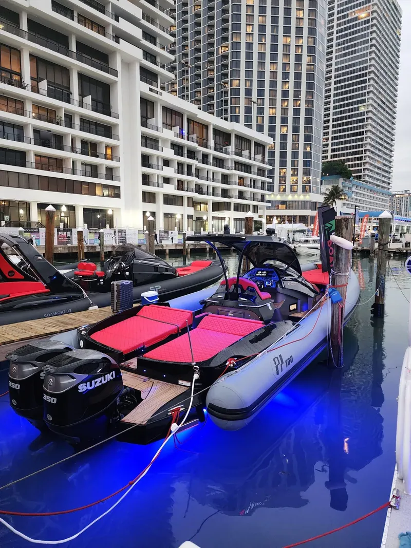 Slide: The Image of Panamera Yacht PY 100, 2021 model, docked with vibrant blue underwater lights. - 2