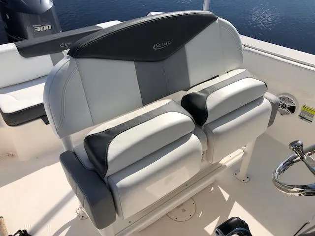 Slide: The Image of 2022 Robalo R242 Center Console boat seating with dual cushioned seats. - 17