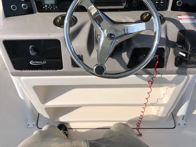 Slide: The Image of 2022 Robalo R242 Center Console steering wheel and dashboard view. - 20